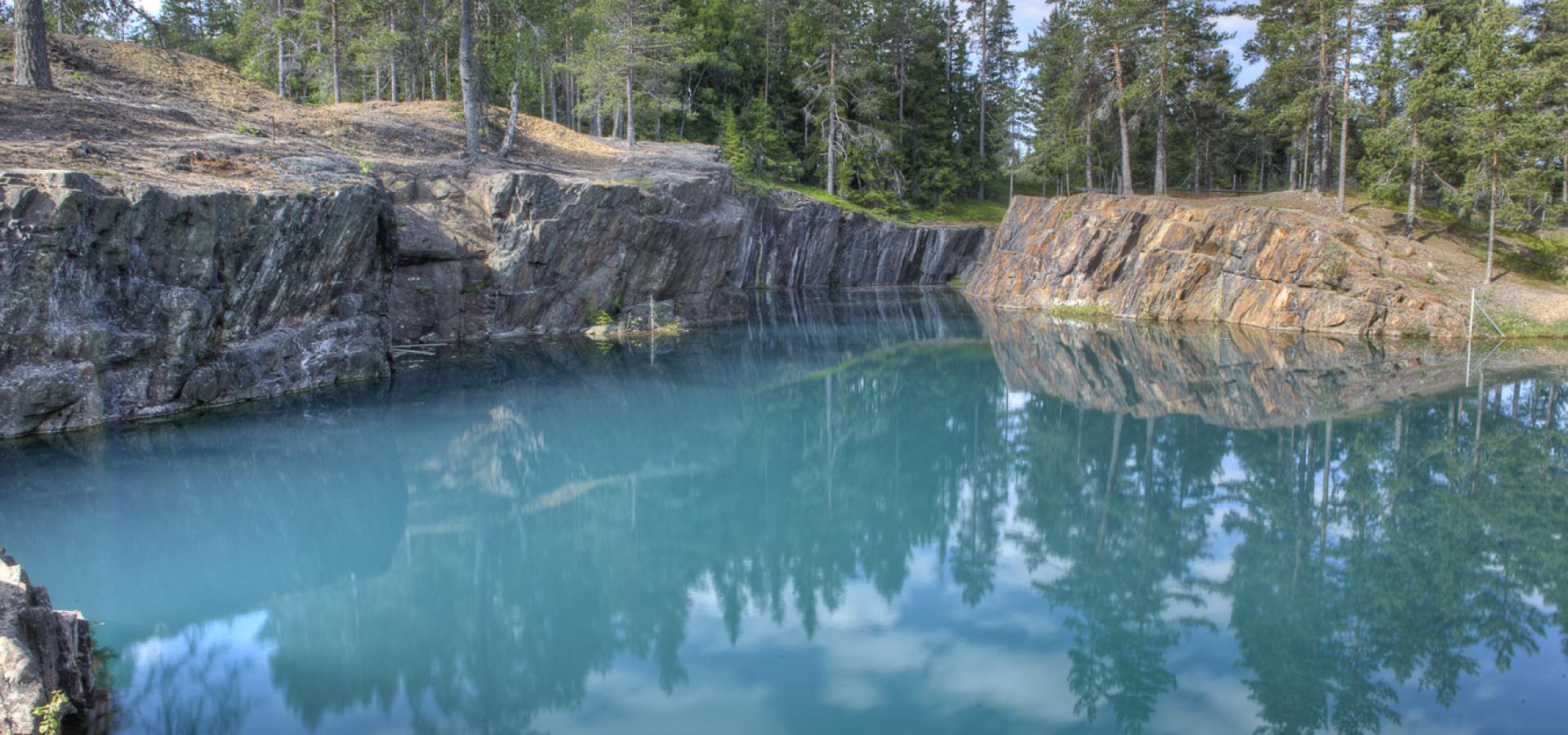Turquoise Water in a limestone quarry.