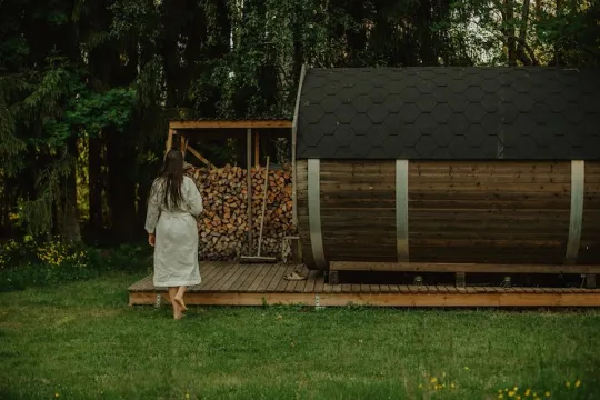 Girl walking towards a sauna.
