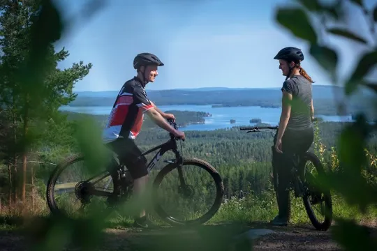 Two cyclists at a viewpoint.