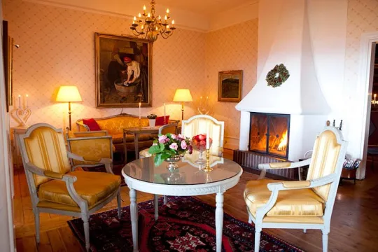 Antique furniture and an open fire place.