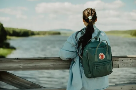 Girl looking out over water.