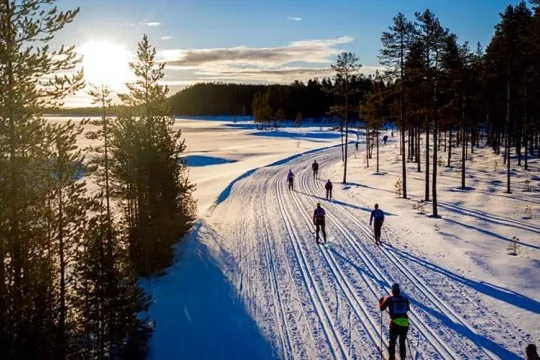 Skiers in the sunrise.