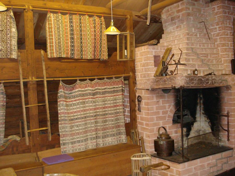 Bunk bed beside a open fire place.