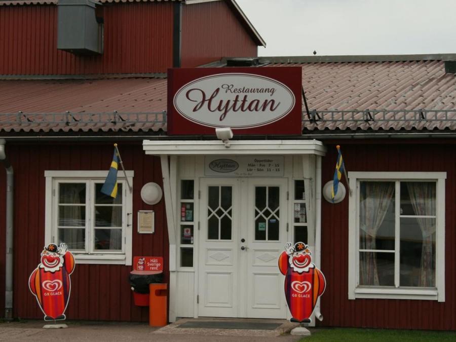 The entrance to the restaurant with a sign above the door.