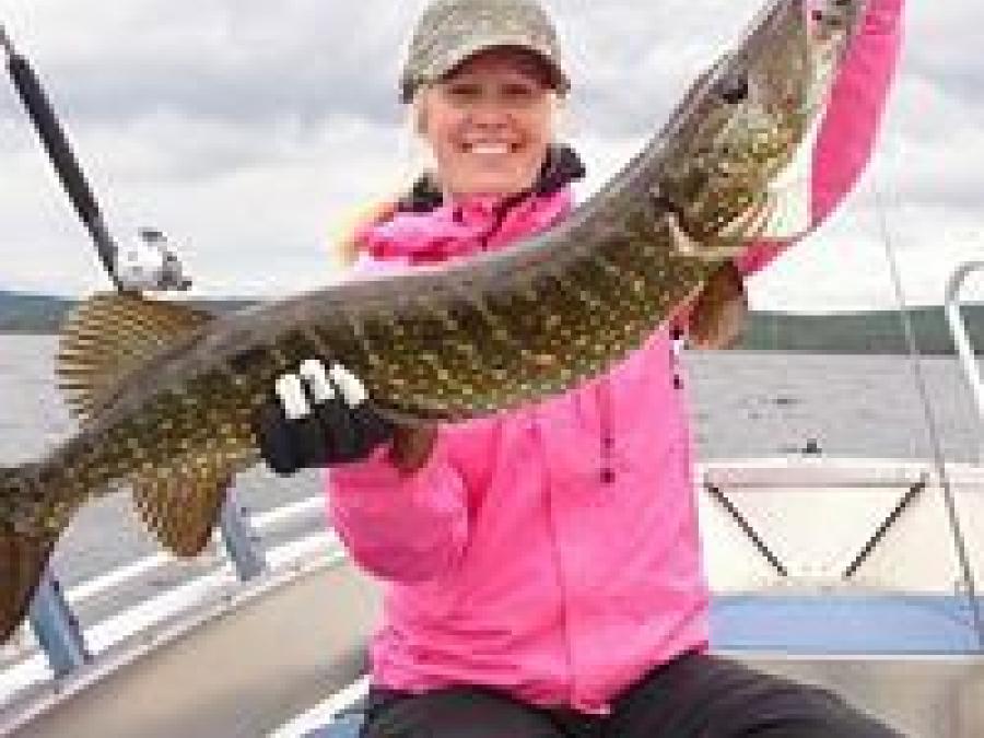 A girl with a large pike.