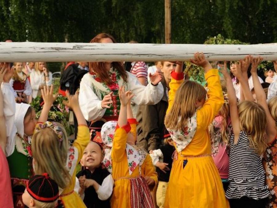 Costume dressed children and adults.