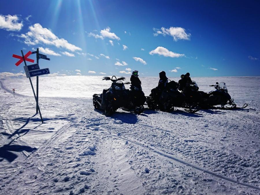 Parked snowmobiles in the mountain 