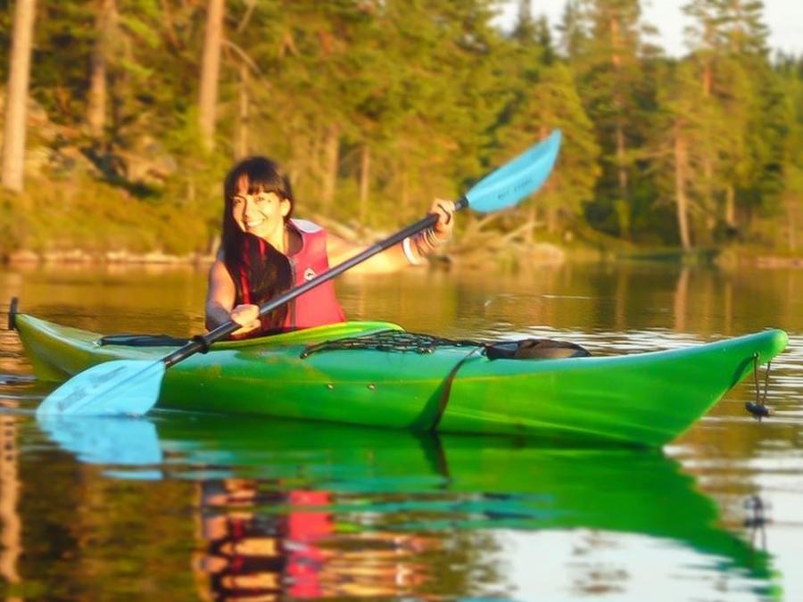  A girl is sitting in a canoe.