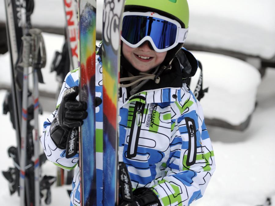 A child with ski's.