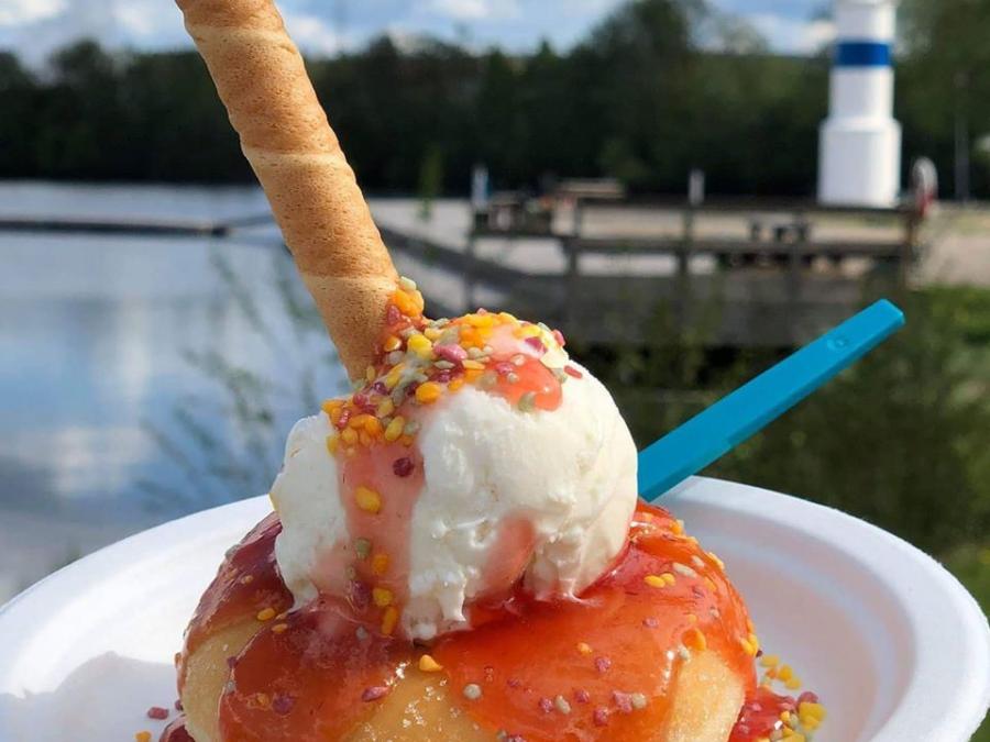 ice cream on plate with the lake behind.