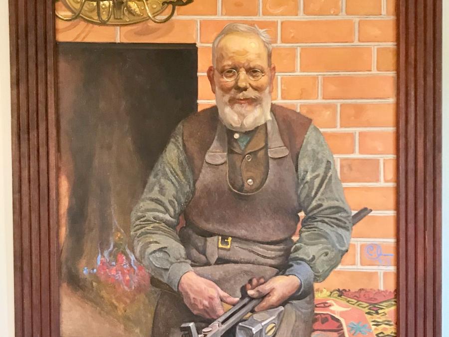 Portrait depicting a blacksmith painted by Carl Larsson.