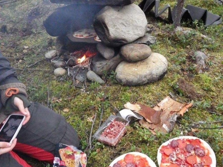 Two pizzas in the nature should be baked on the fire. 