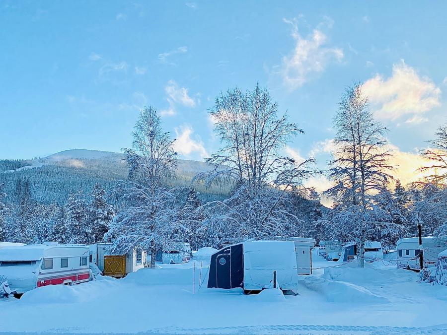 Caravans in winter landscape. 