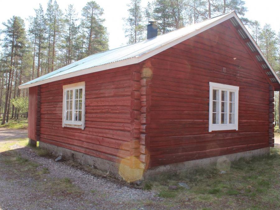 Exterior of a wood hut.