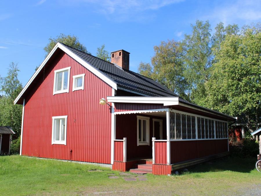 Exterior of a red painted house.
