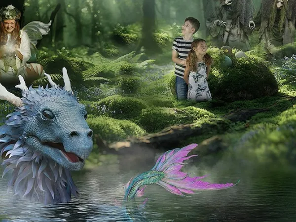 Two children standing in the middle of the magical forest looking at a fairy, troll and dragon.