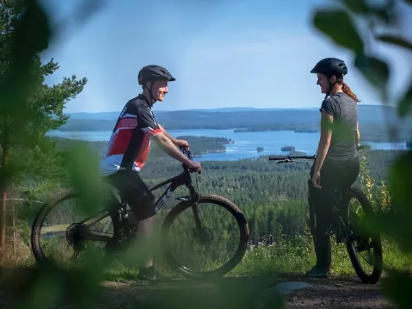 Two cyclists at a viewpoint.