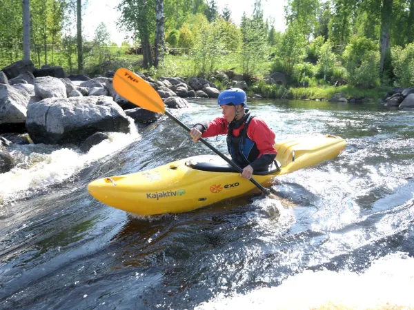 A person paddling in the river.