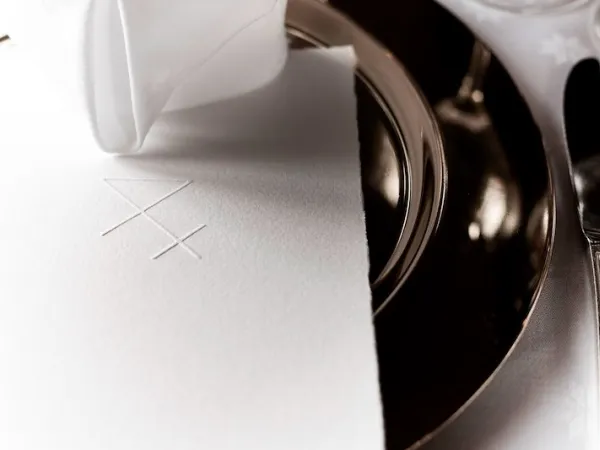 Plate on the table with a menu.