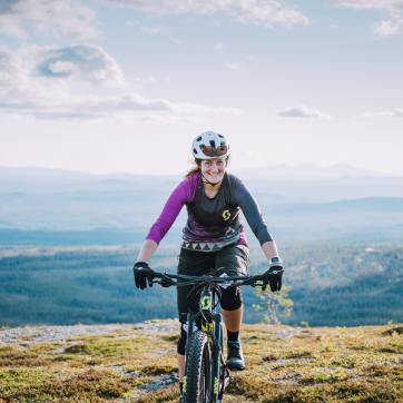 A girl on a mountain bike.