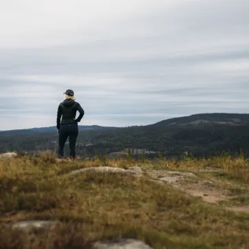 A woman on a hiking trail.