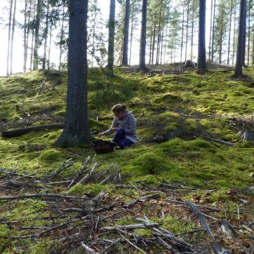 Girl sitting in forest and resting.