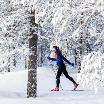 A girl doing some cross-country skiing.