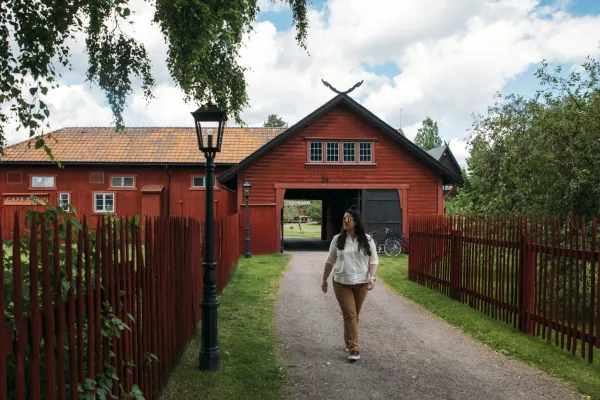 A woman walking on a road.