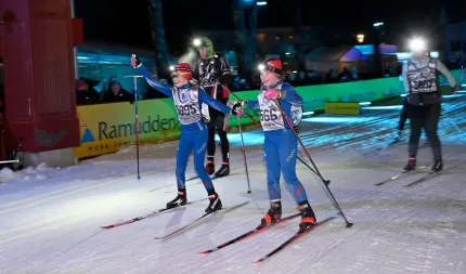 Skiers in the dark.