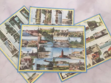 Flera vykort med collage av stadsbilder ligger utspridda på en ljus yta, med blå och gula ramar..