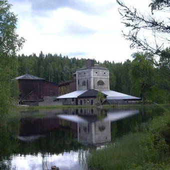 Ågs Bruk with a lake in the foreground.