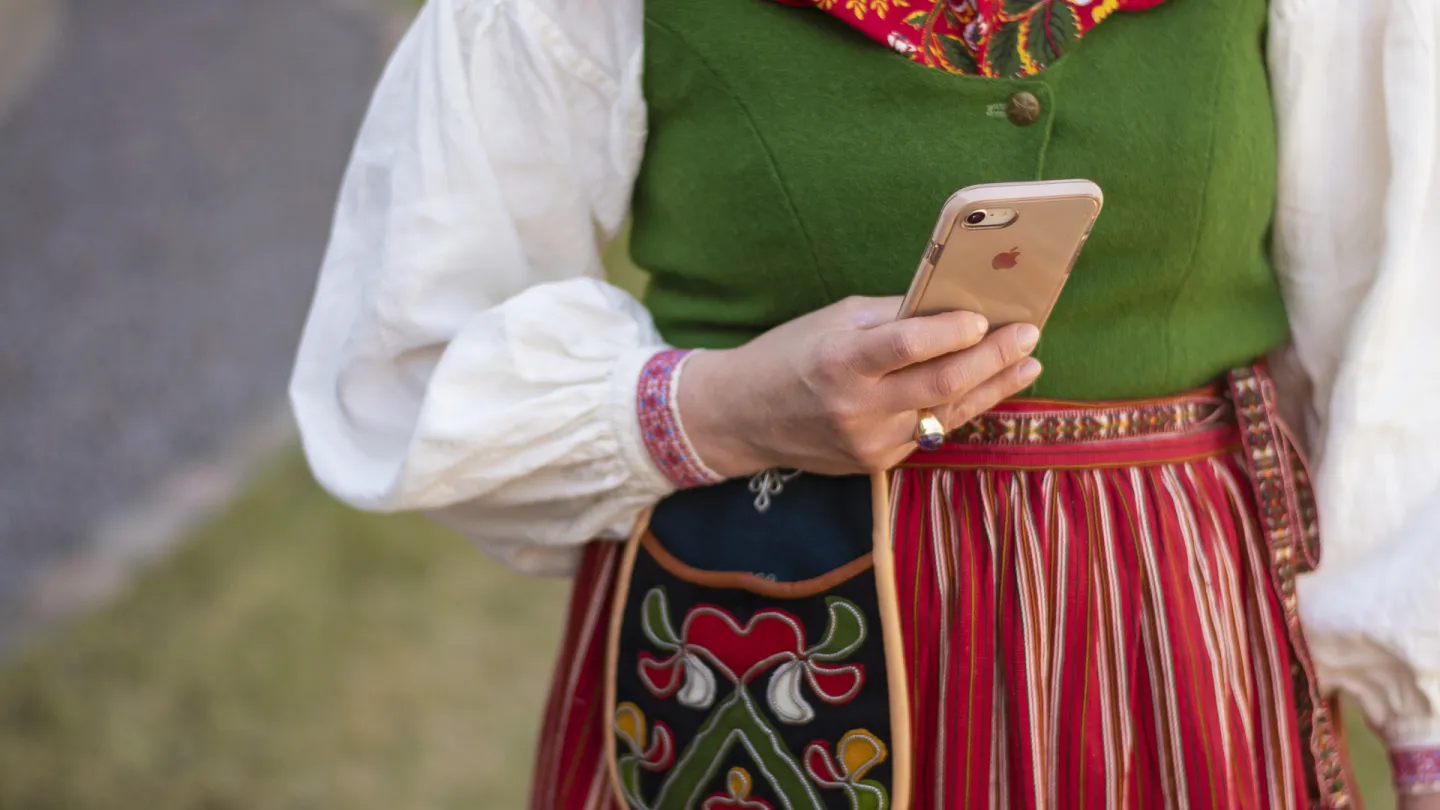 A woman holding a phone.